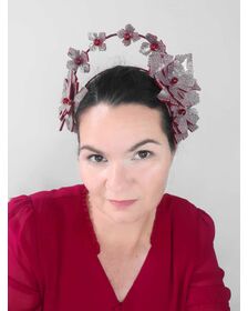 A picture of a red millinery crown halo by Melissa Rath Millinery