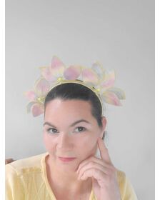 A picture of a rainbow pleather millinery headband by Melissa Rath Millinery