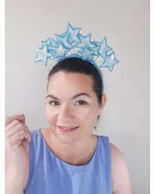 A picture of a blue headband with stars by Melissa Rath Millinery