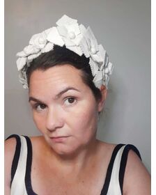 A picture of a white leather millinery crown by Melissa Rath Millinery