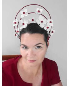 A picture of a red and white halo crown by Melissa Rath Millinery