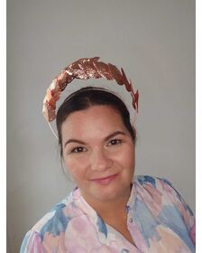 A picture of a Rose Gold Leaf Headband by Melissa Rath Millinery