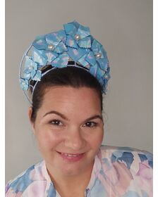 A picture of a Blue Pleather Millinery Crown by Melissa Rath Millinery.