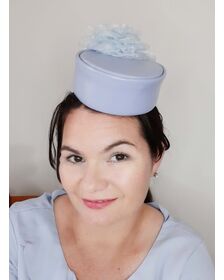 A picture of a blue leather millinery headpiece by Melissa Rath Millinery.