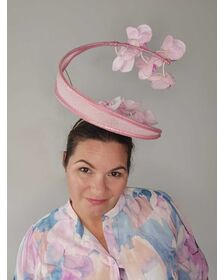 A picture of a Pink Orchid Floating Headpiece by Melissa Rath Millinery