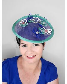 A picture of a blue and green saucer hat by Melissa Rath Millinery listed on hatporium