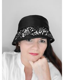 A picture of a black and white felt cloche by Melissa Rath Millinery