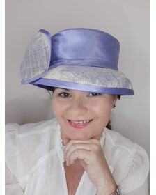 A picture of a blue and white picture hat by Melissa Rath Millinery.