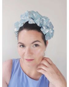 A picture of a blue pleather millinery crown by Melissa Rath Millinery listed on Hatporium