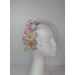 A picture of a rainbow veiled headband by Melissa Rath Millinery