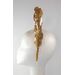 A picture of a Gold Leaf Millinery Headband by Melissa Rath Millinery