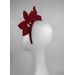 A picture of a red and white leather headband by Melissa  Rath Millinery