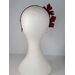 A picture of a red headband in pleather and felt by Melissa Rath Millinery